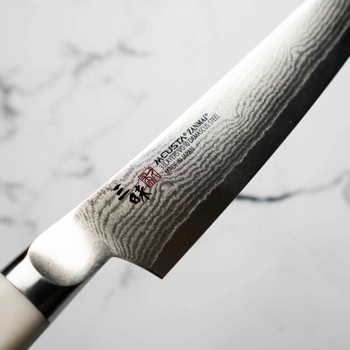 Mcusta Zanmai Corian Classic VG10 Damascus Petty 150mm